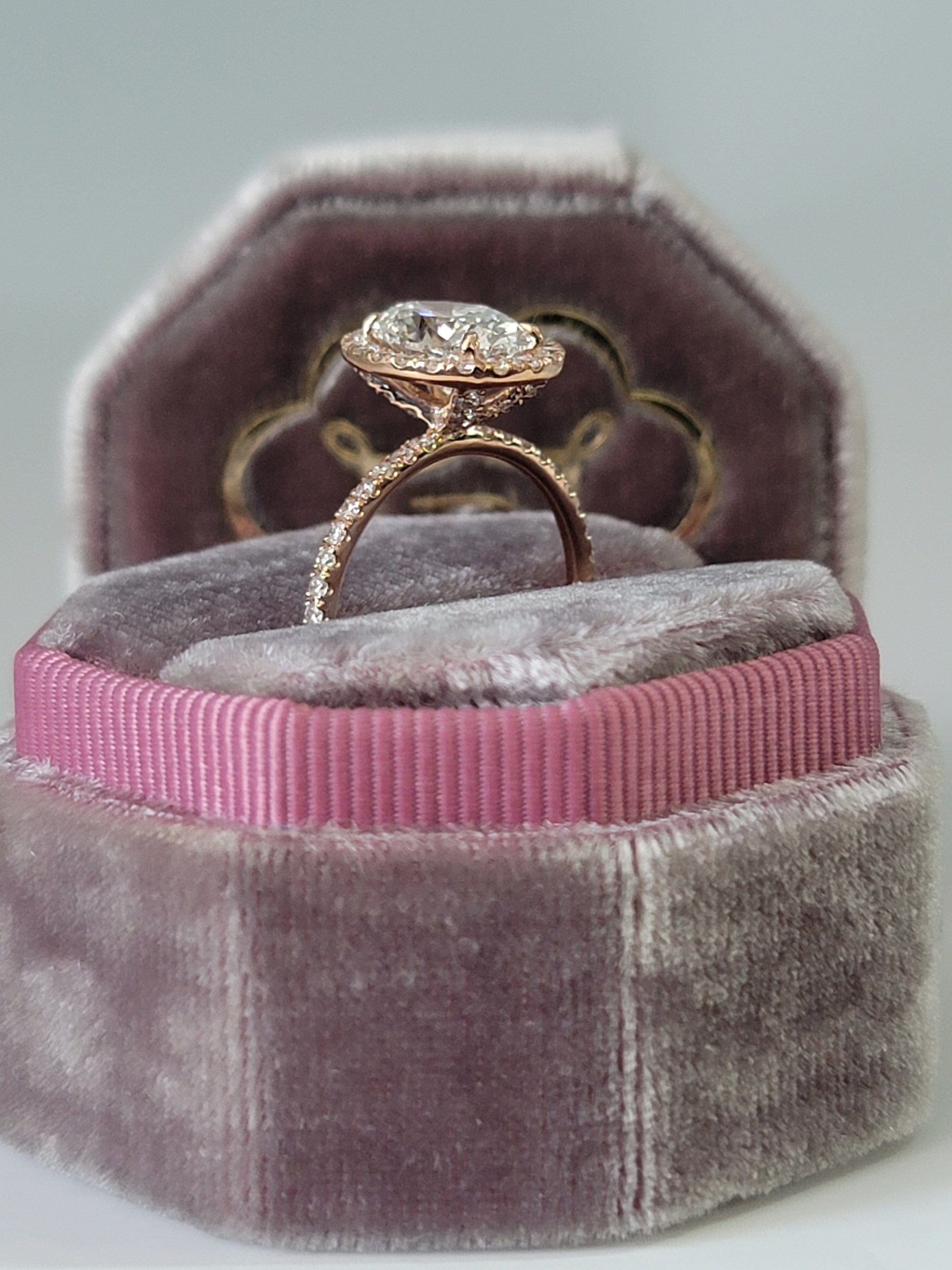 Diamond ring in velvet ring box.