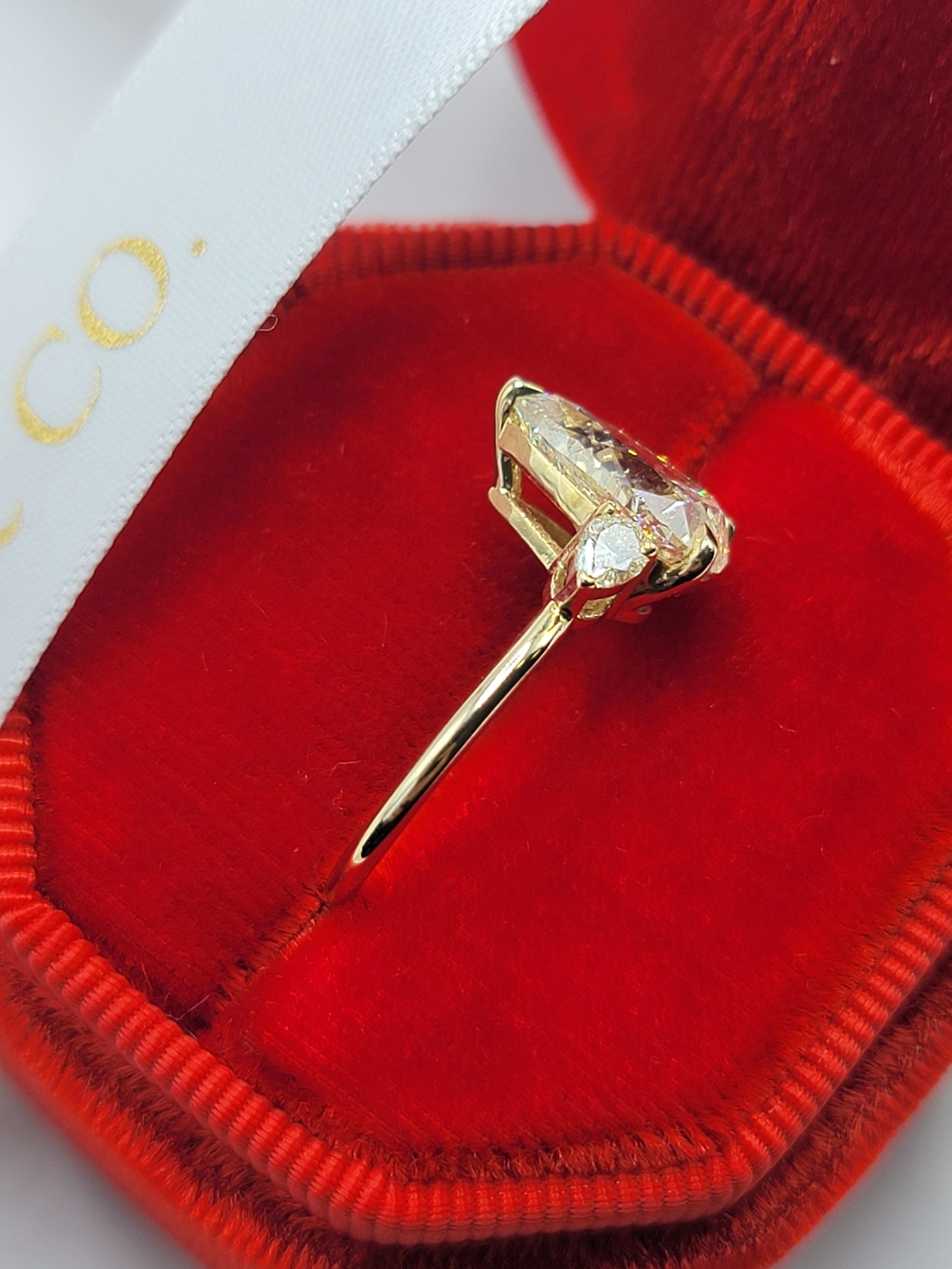 Diamond ring in a red velvet box.