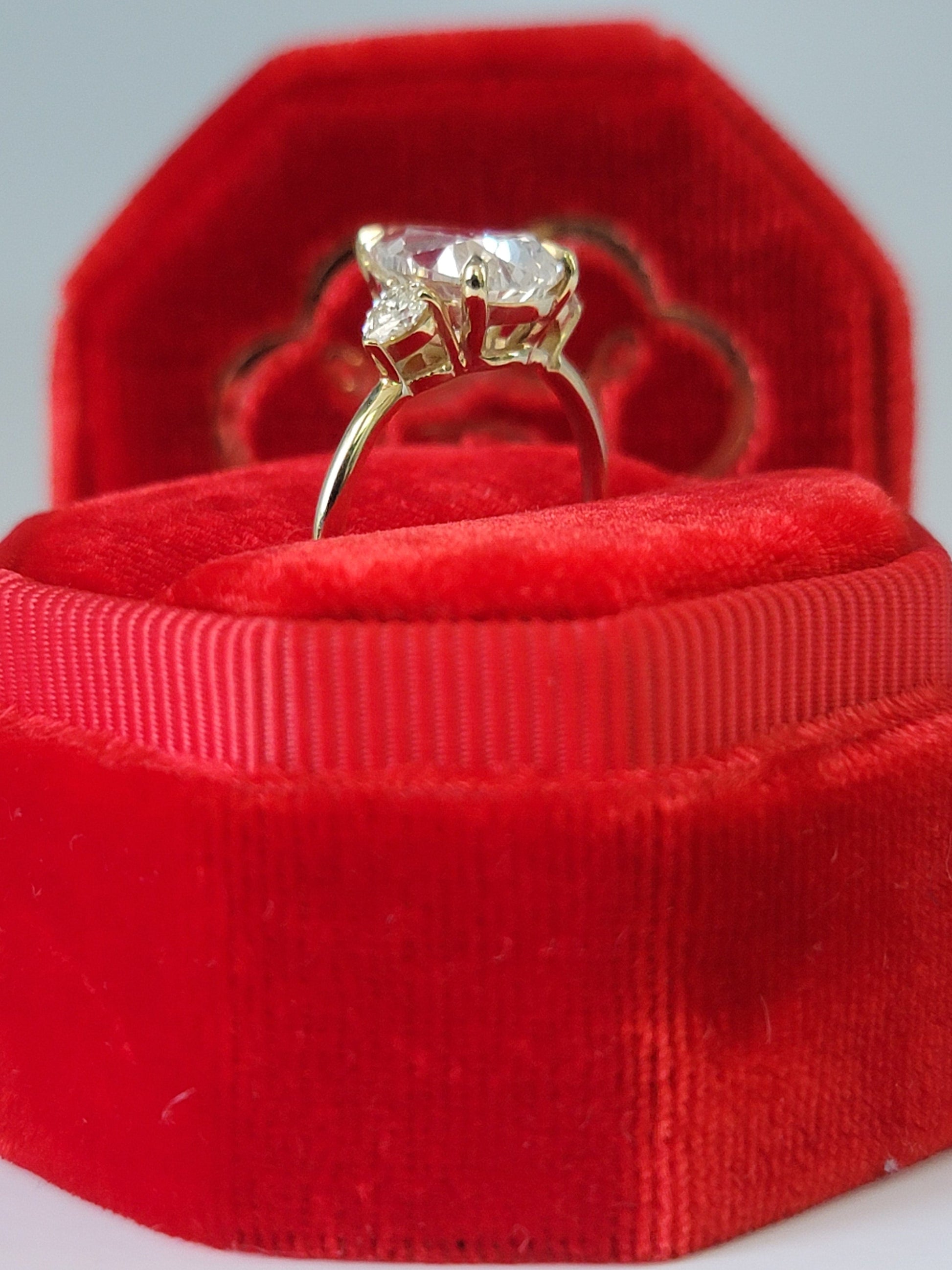 Diamond ring in red velvet box.