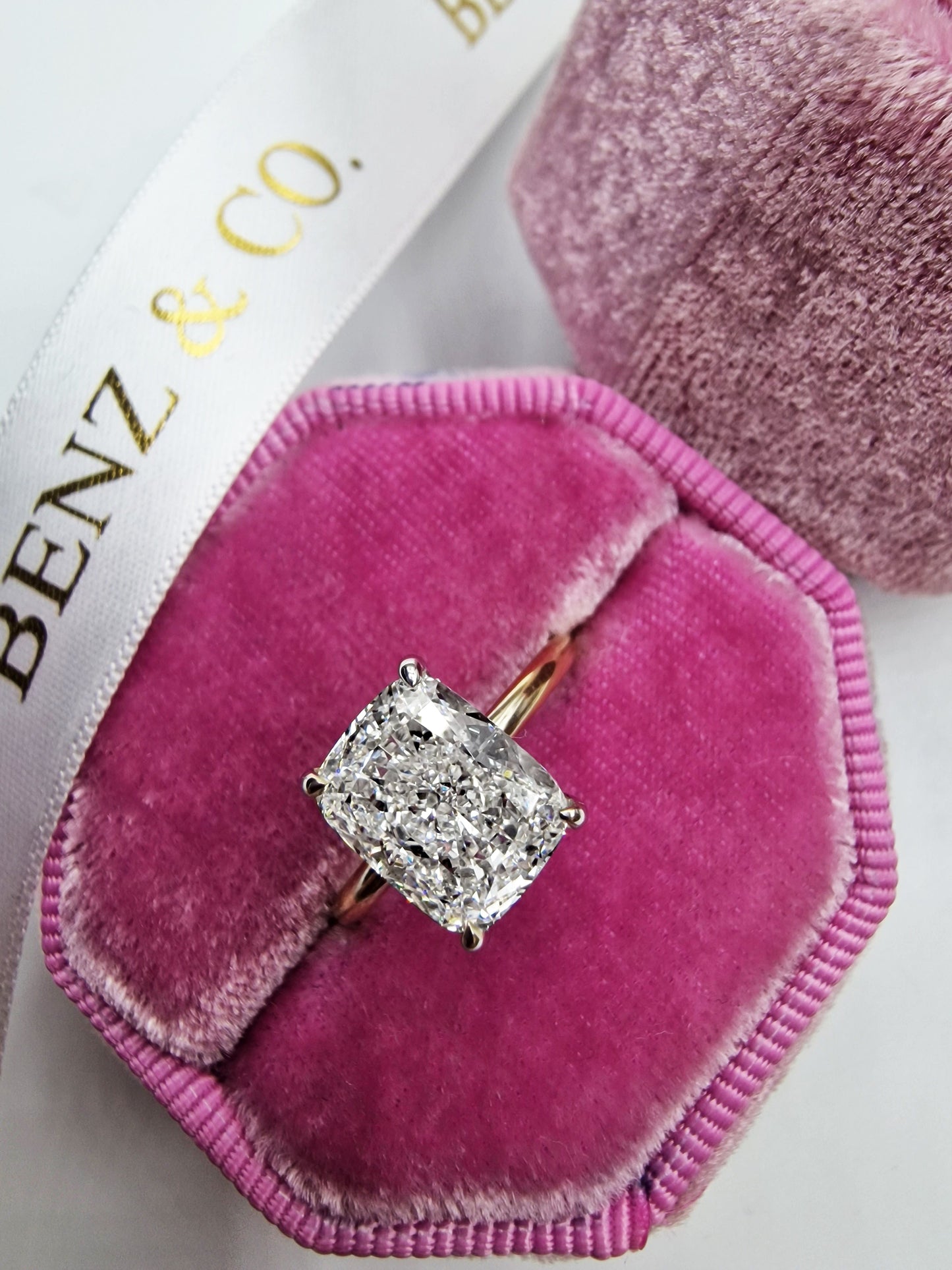 Diamond ring in a pink velvet box.