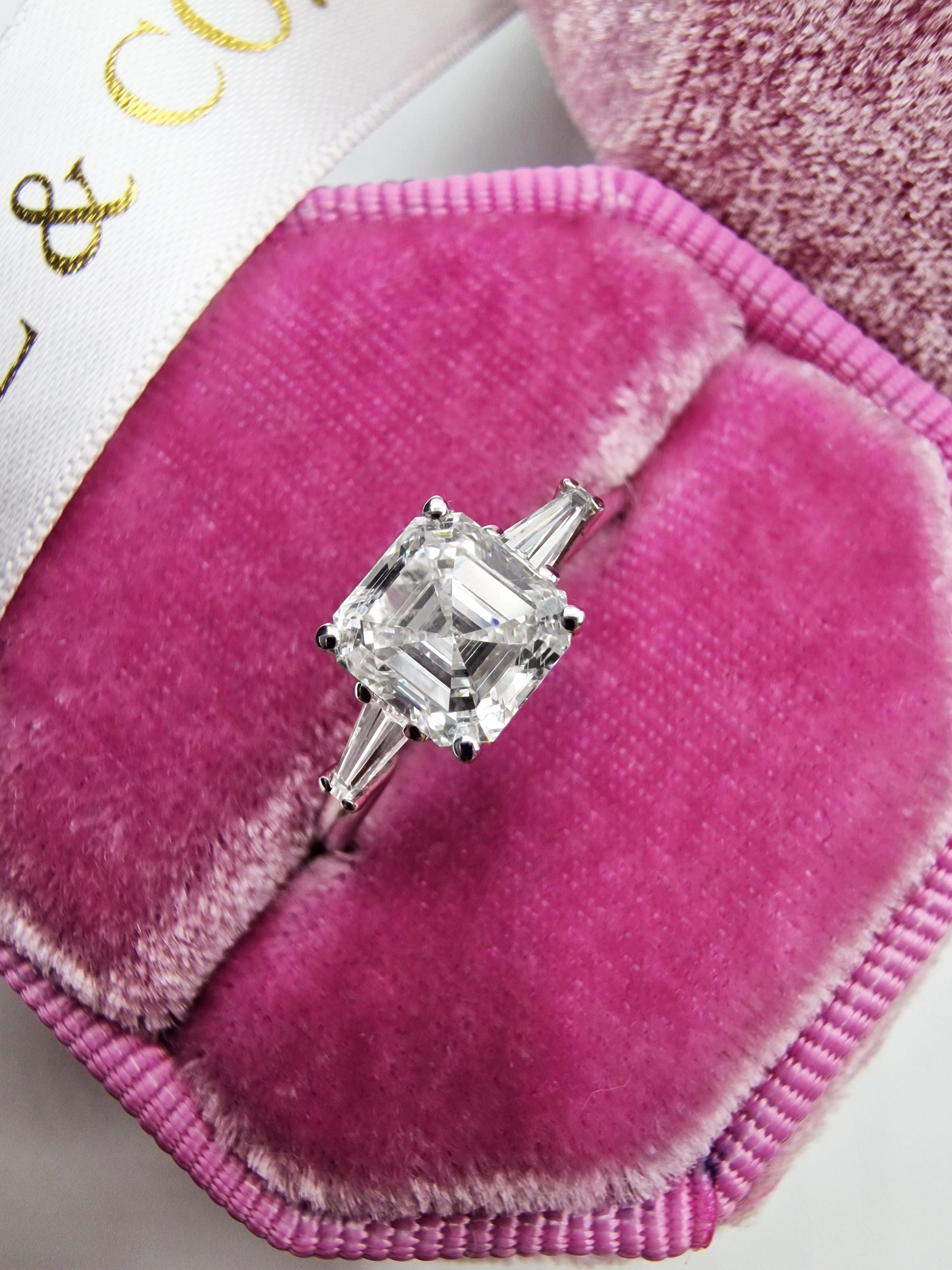 Diamond ring in a pink velvet box.