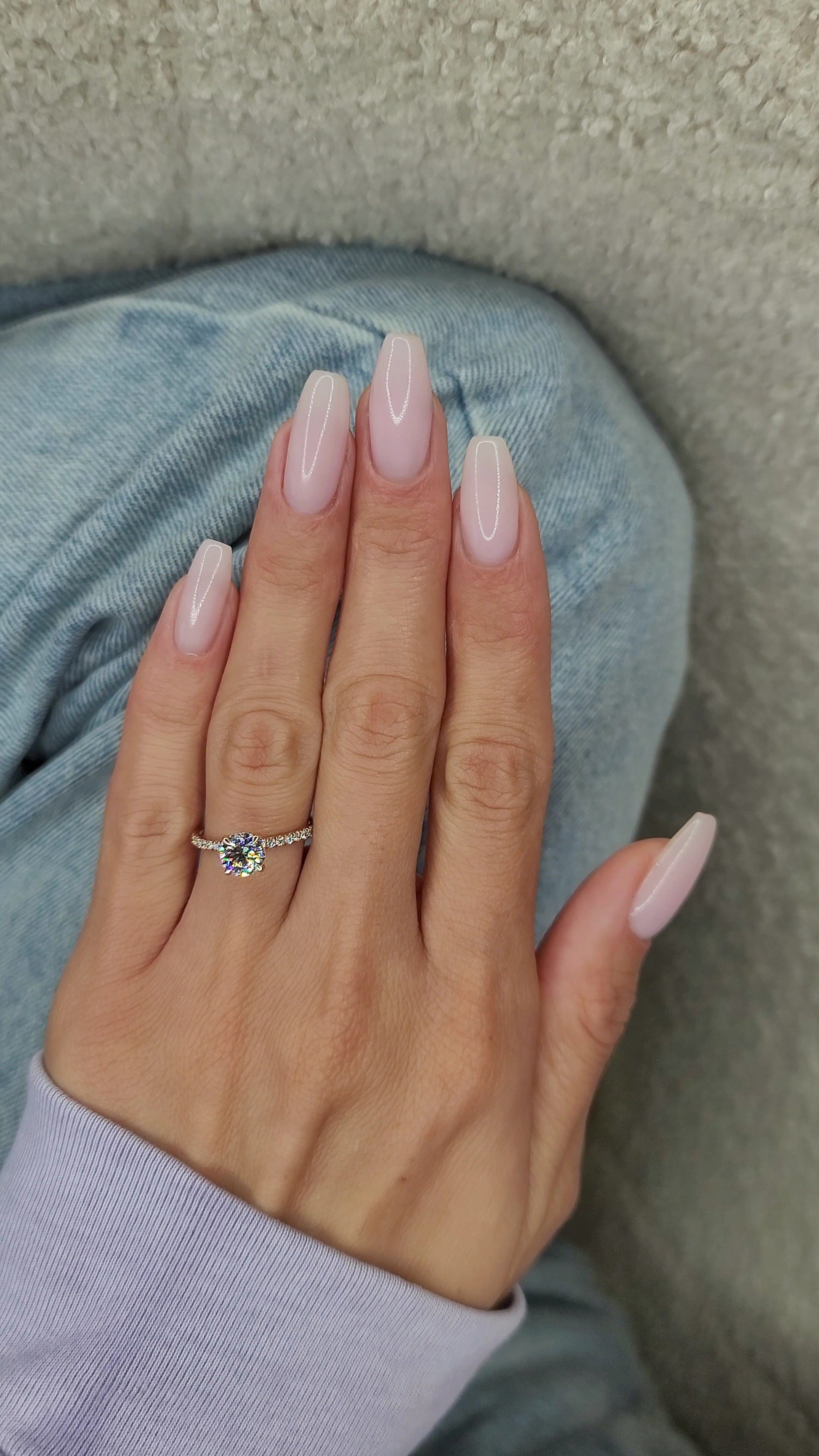 Pale pink manicure with ring, captured Jan 29, 2023