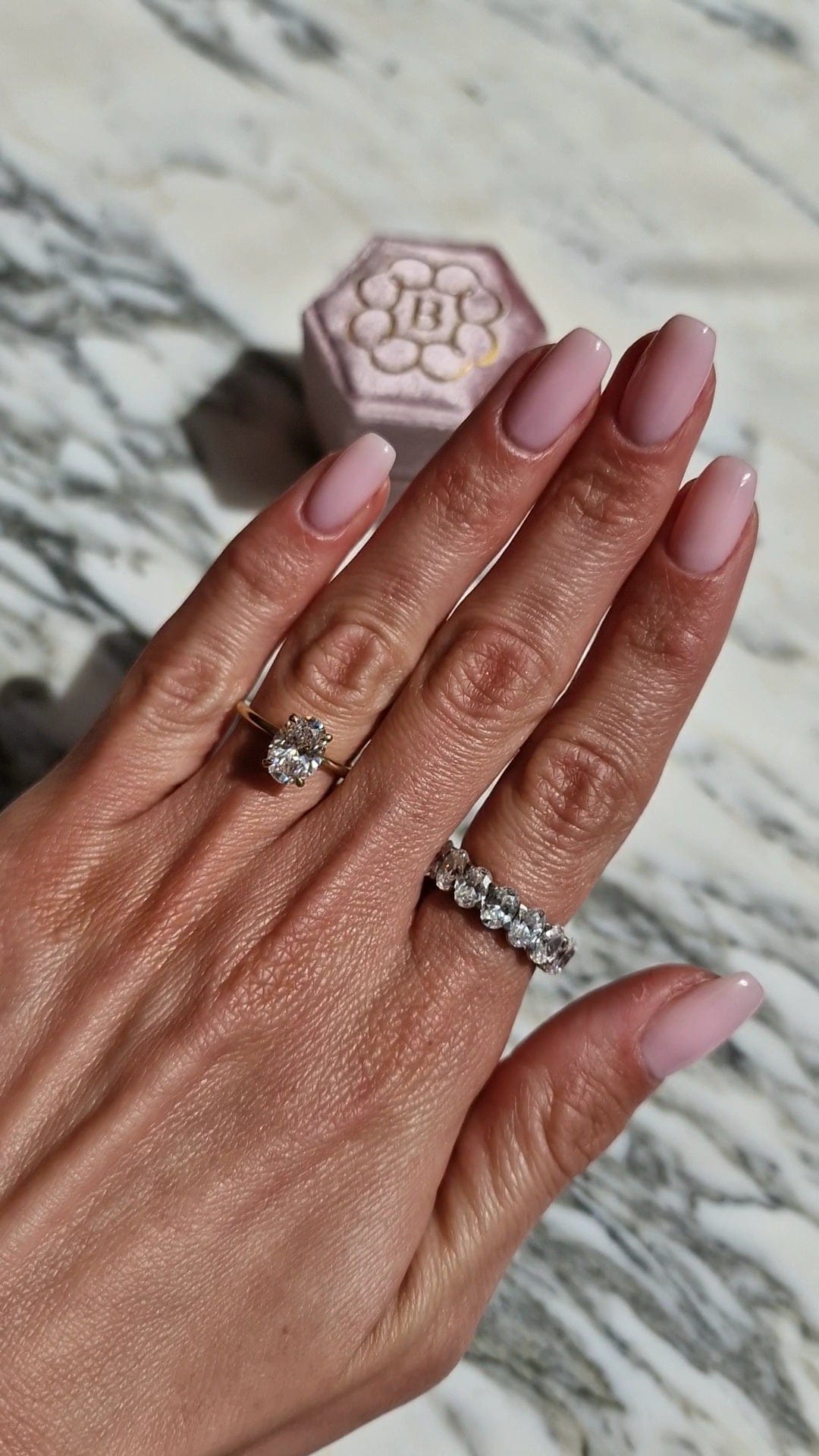 Diamond rings and nail polish, captured March 13, 2023
