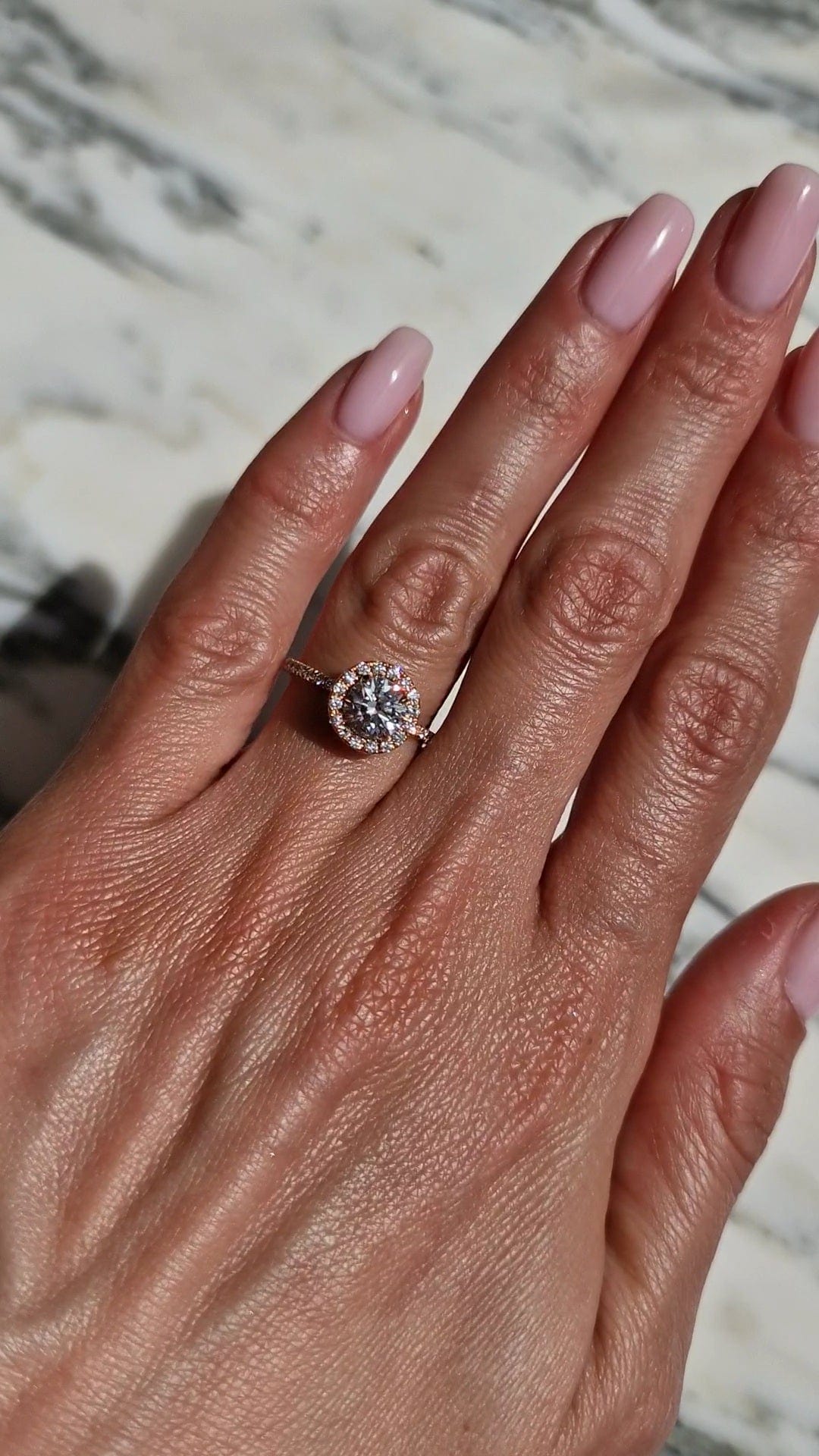 Diamond engagement ring on hand, captured April 2, 2023