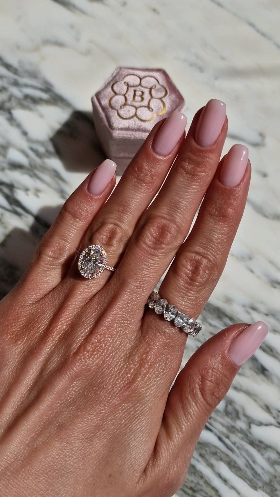 Engagement ring and band, shown on hand, captured 2023-04-11