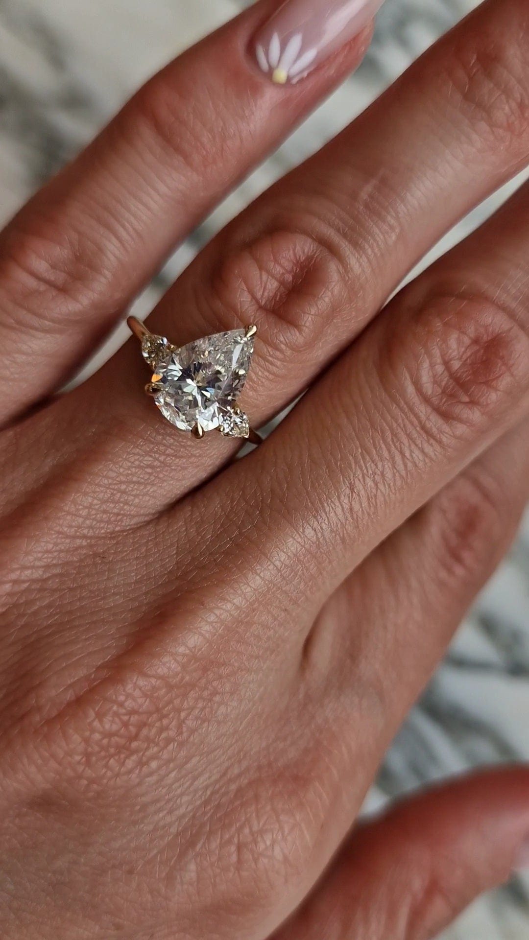 Diamond engagement ring on hand, captured 2023-04-20