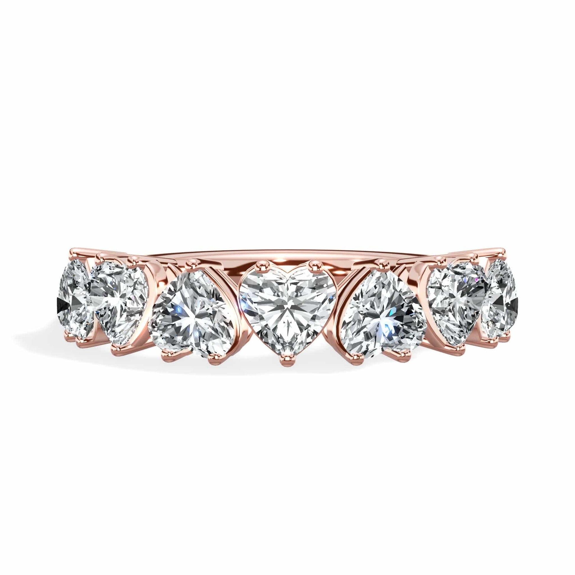 Rose gold ring with heart-shaped diamonds.