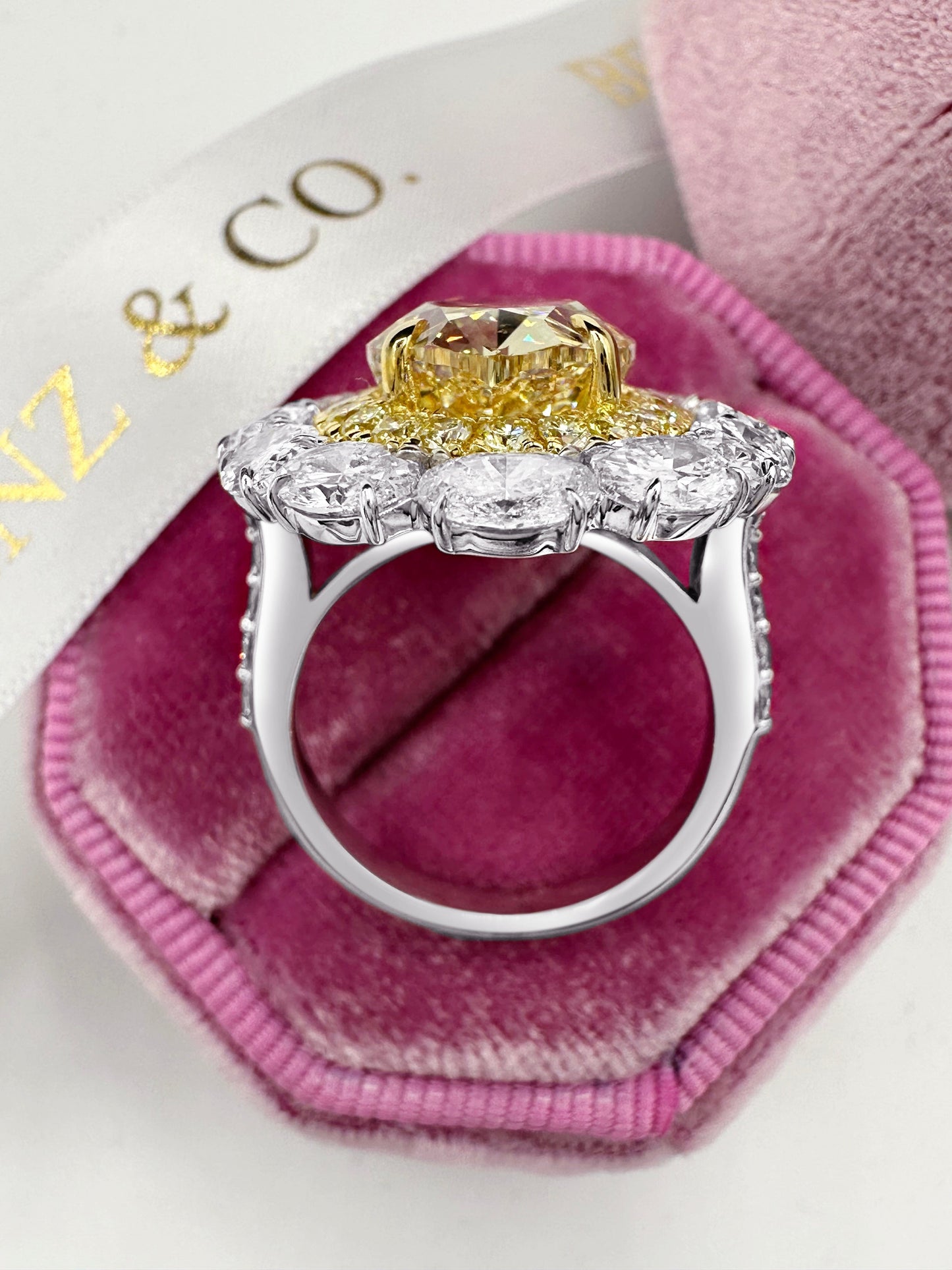 Cocktail diamond engagement ring with yellow canary diamond halo