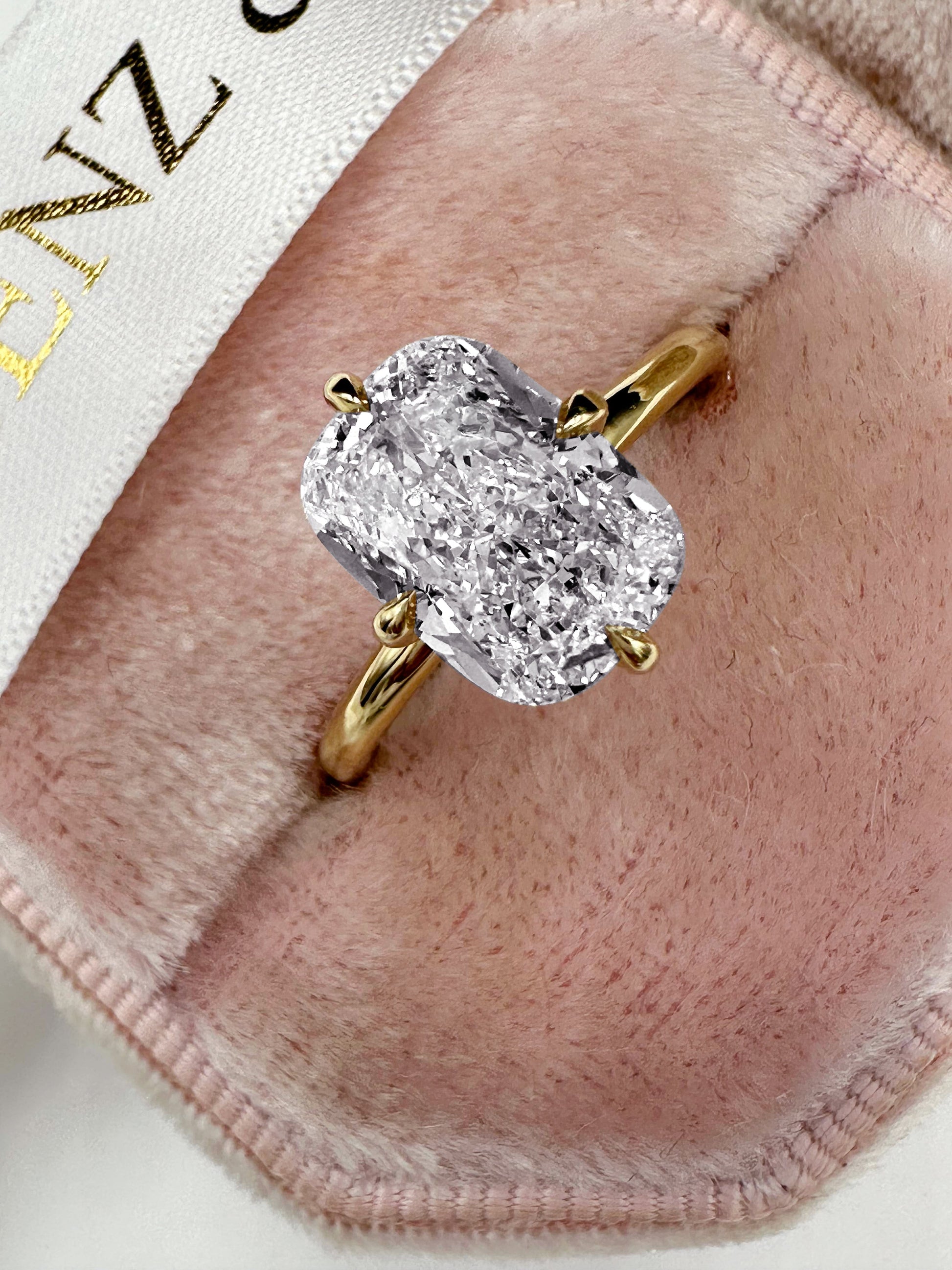 Elongated cushion cut lab diamond ring in yellow gold.