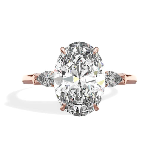 3.38 Carats Lab Grown Oval Cut with Pear Shaped Side Stones Diamond Engagement Ring in Rose Gold