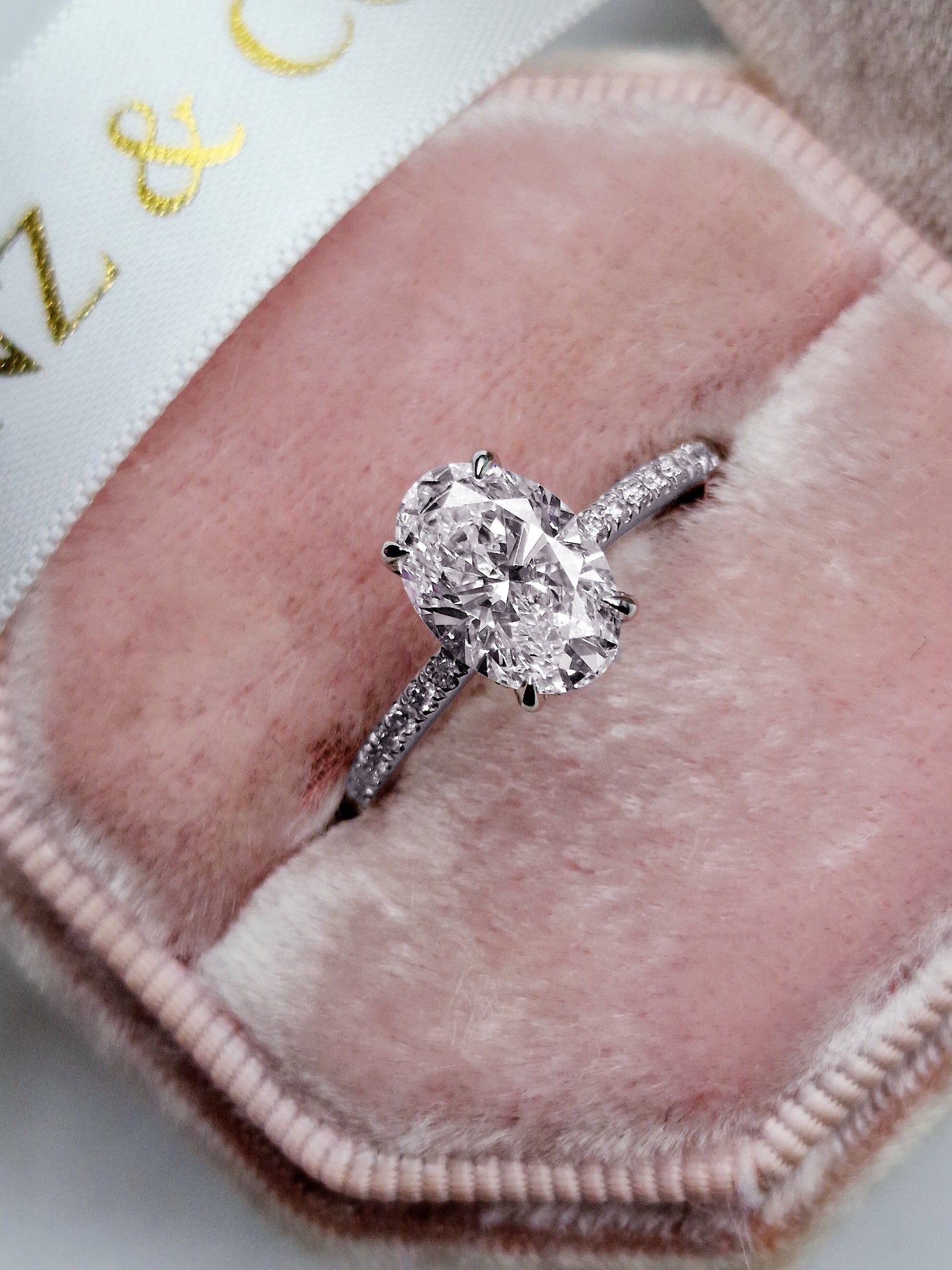 Oval cut 1.5ct lab grown diamond engagement ring with hidden halo