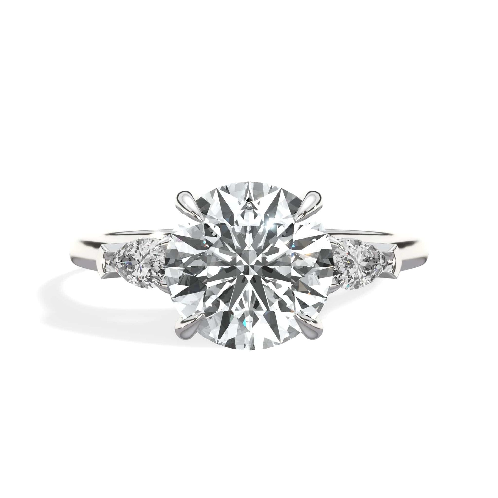 Round diamond engagement ring with pear side stones