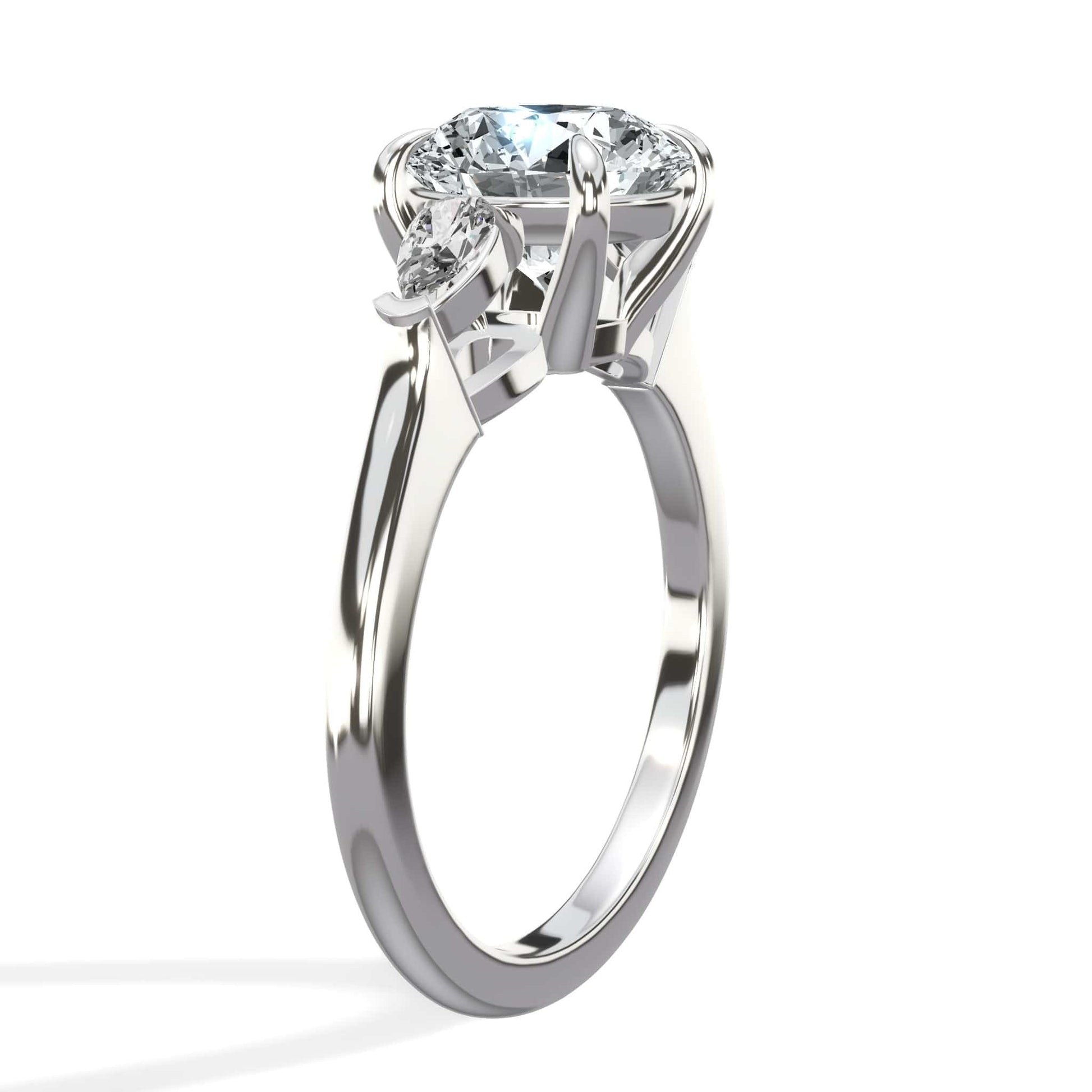 Round diamond engagement ring with pear side stones