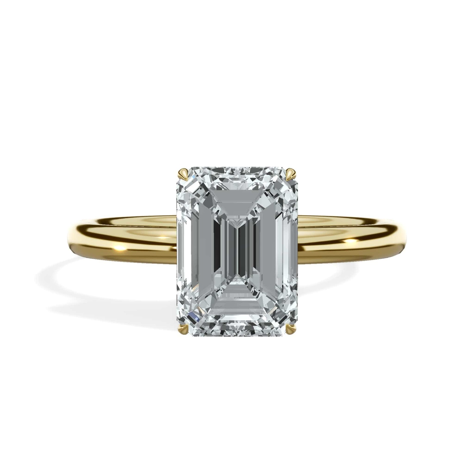 Emerald cut diamond ring in yellow gold