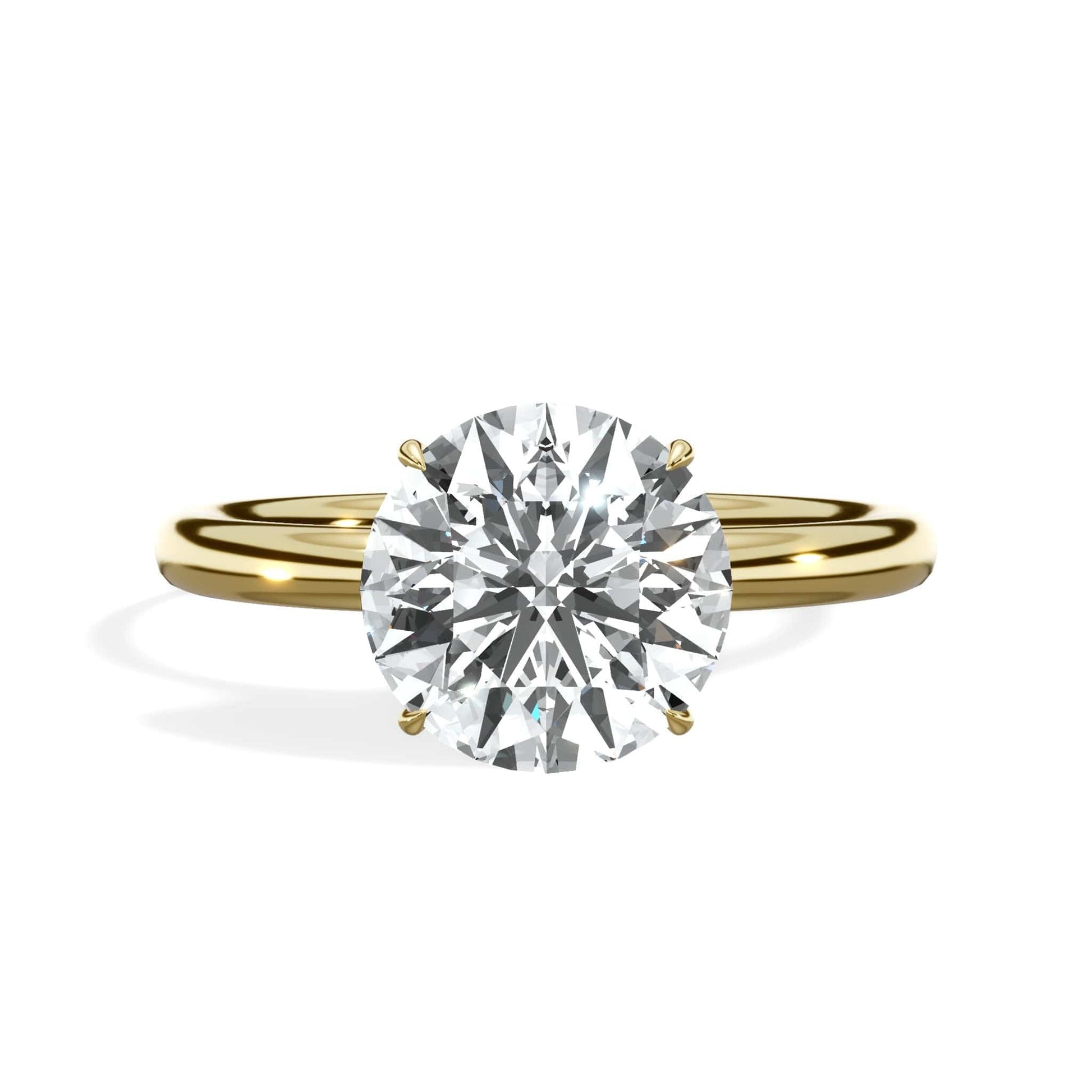 Round diamond engagement ring in yellow gold