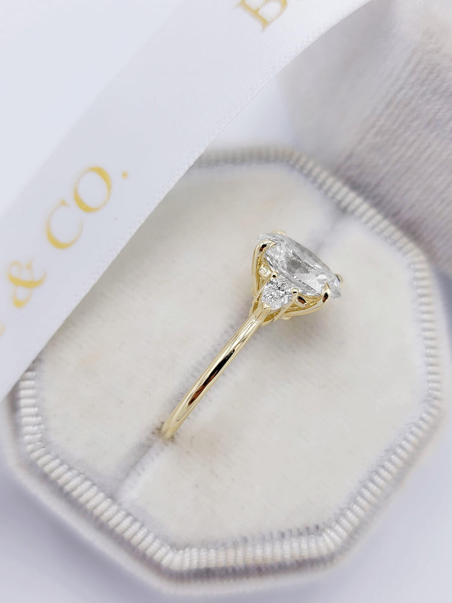 2.40 Carats Lab Grown Oval Cut with Pear Shape Side Stones Diamond Engagement Ring in Yellow Gold - BenzDiamonds