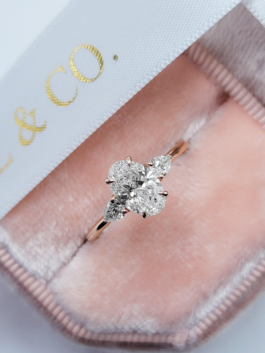 1.30 Carats Lab Grown Oval Cut with Pear Shape Side Stones Diamond