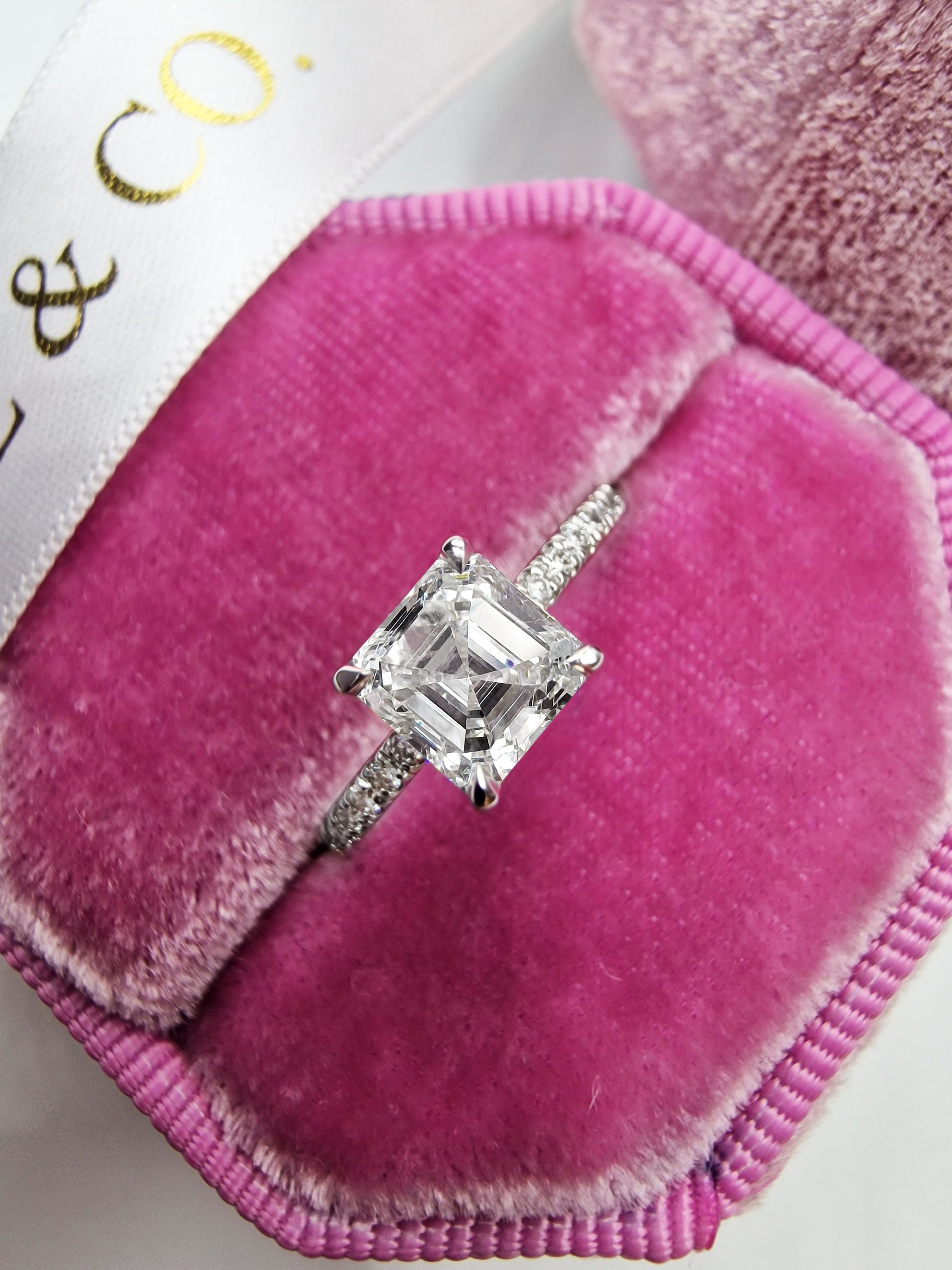 Diamond ring in pink velvet box.