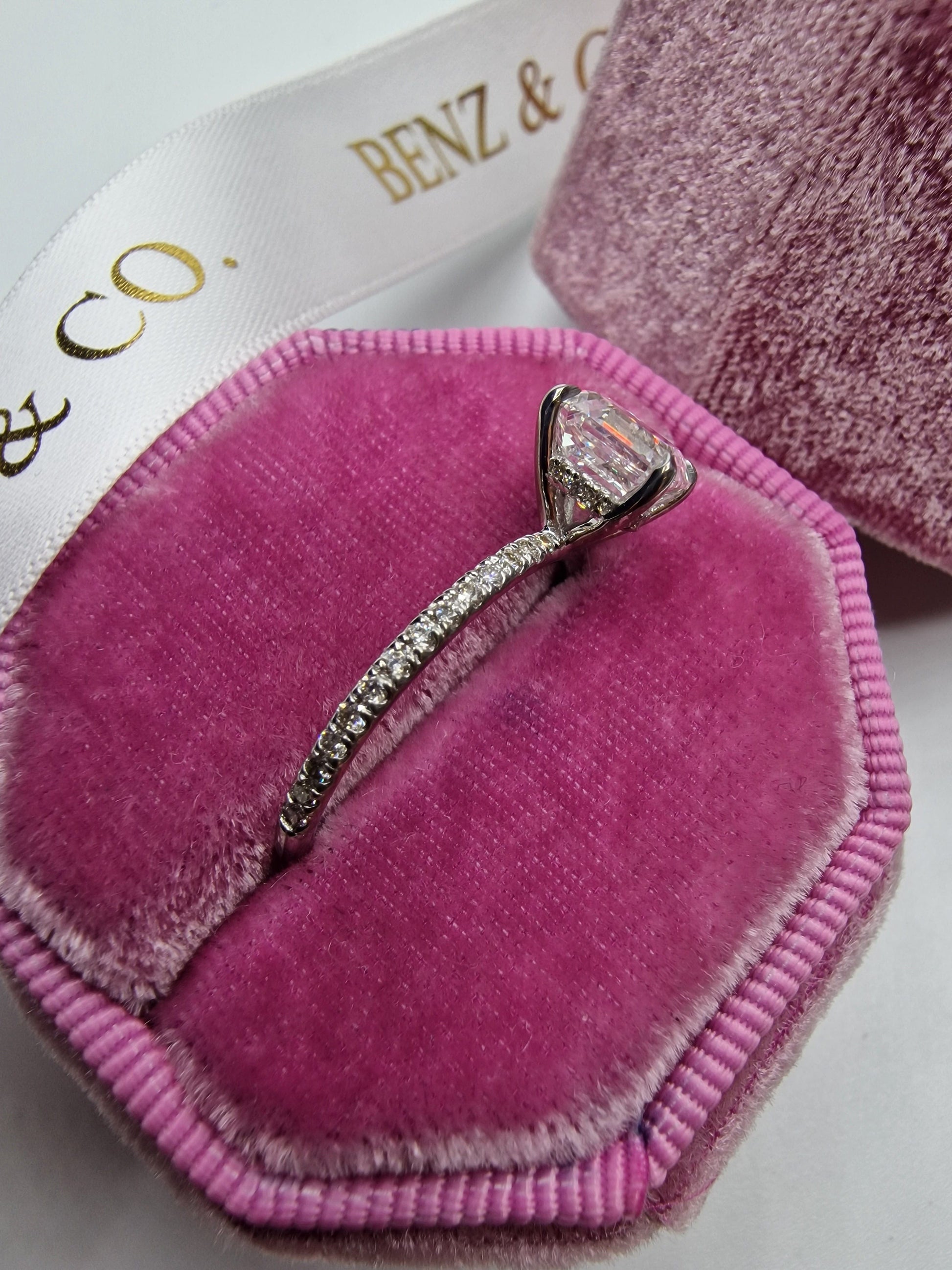 Diamond ring in a pink velvet box.