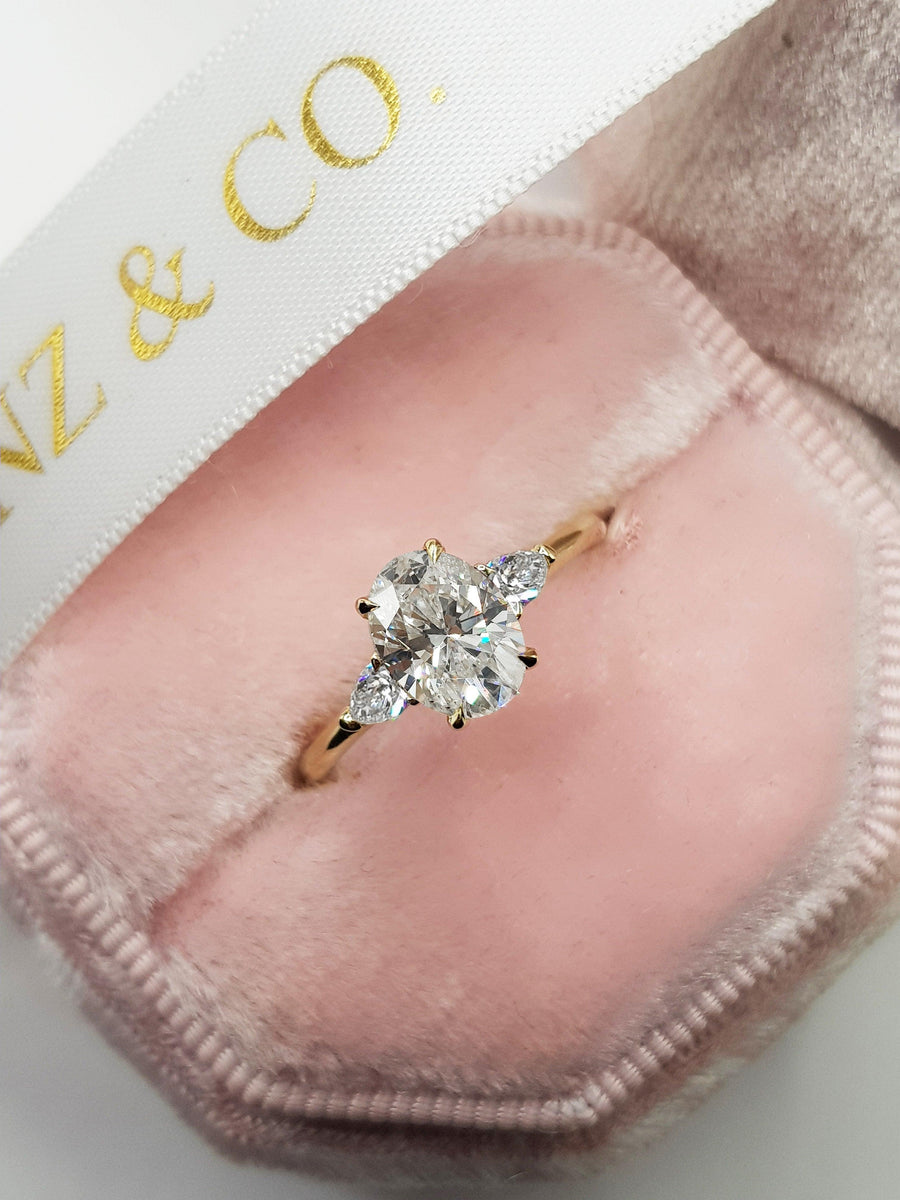 1.30 Carats Oval Cut with Pear Shape Side Stones Diamond Engagement Ring in Yellow Gold - BenzDiamonds